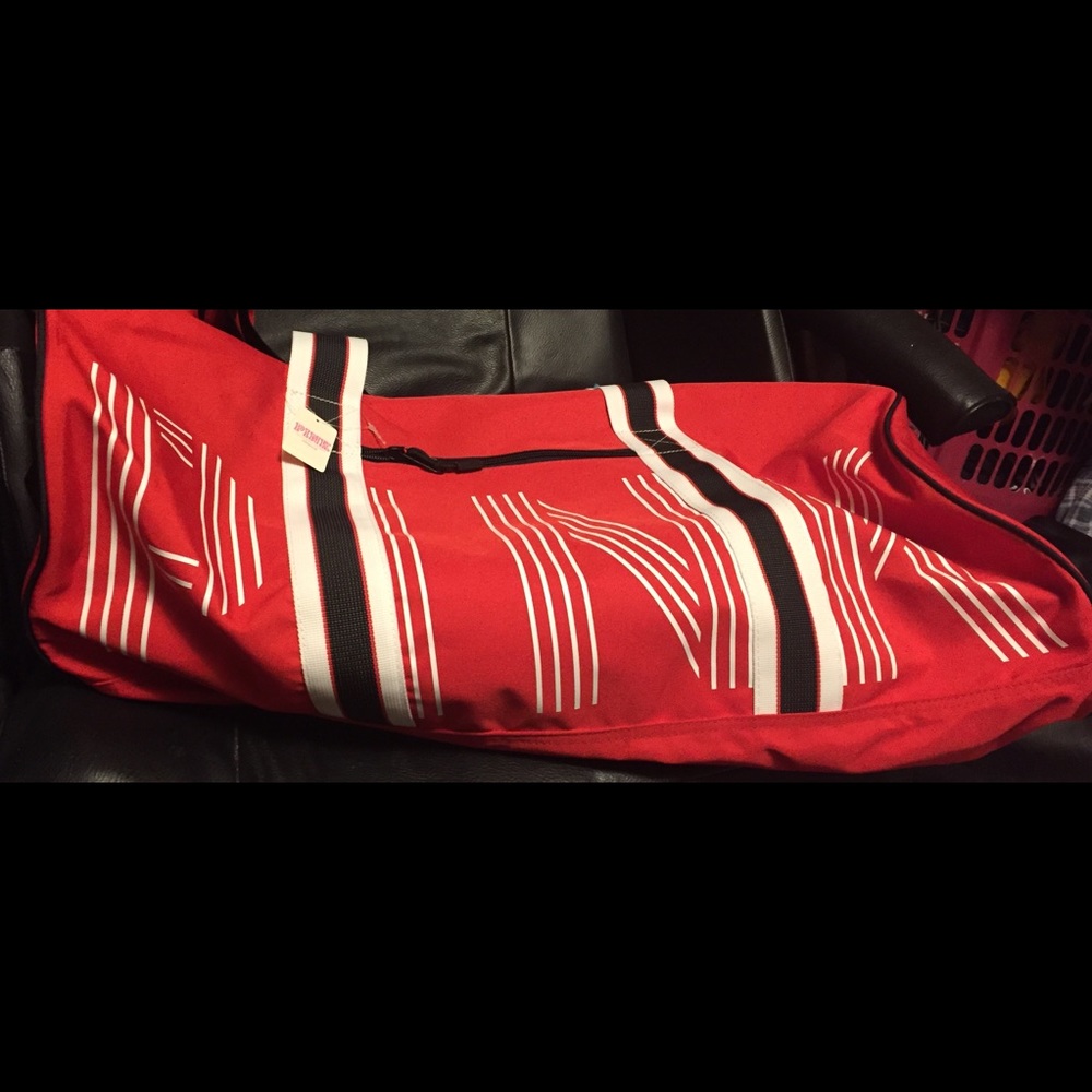 Pink red duffle bag